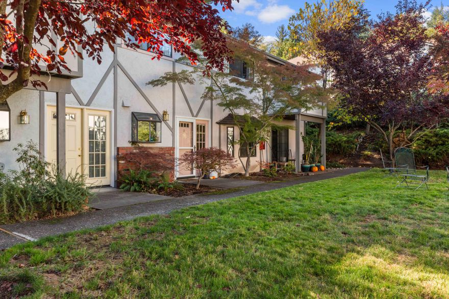 Well maintained move in ready 2 bed 1.5 bath condo conveniently located near the hospital and Downtown Ashland inside the Helman School attendance zone. This unit has been nicely updated and sits quietly away from the road and parking area. Garden windows in the remodeled kitchen look upon the large grassy courtyard with shade trees. From the two designated parking spots it's a smooth level path to the front door. The main level includes the kitchen, dining area, living room, half bath, and it opens to a private fenced patio. Upstairs has two large bedrooms, a balcony, and a remodeled bathroom with double vanity lit with a solar tube. Recent updates include luxury vinyl flooring, custom pantry, new appliances, and fixtures. Low HOA dues of $210/mo cover the designated parking spaces, common area landscaping and water, roof, maintenance, sewer, and garbage.