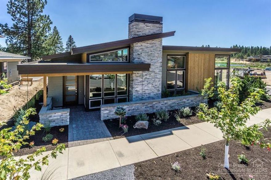 Mid-Century beauty in Bend's popular NorthWest Crossing neighborhood. Just a block from the lake at Discovery Park, this home by Heritage Homes Northwest boasts high end finishes throughout with hardwood floors, slab countertops and stainless steel appliances. Soaring ceilings and floor to ceiling windows bathe the home with Central Oregon's sunshine and blue skies.