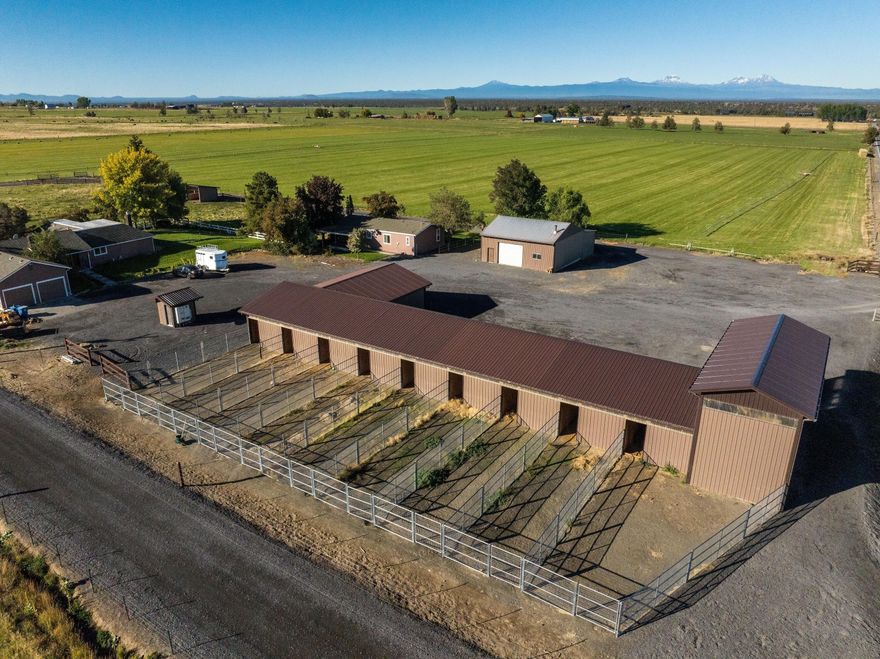 Cascade Mountain Views from homes, shop and barn in the heart of Powell Butte. Property is 39 acres with 34.6 acres of COID water rights to irrigate hay fields and livestock pastures. Main home is 2157 sq ft that with large kitchen/dining area, living room with wood burning fireplace, master suite with tub, shower, walk-in closet, 2 car garage, deck and landscaped. Shop is finished, heated, water, storage and attached garage.  Horse barn with 9 stalls, steel runs, automatic heated Nelson waterers and steel runs, tack room and attached Hay/RV storage area. Second home is 1296 sq ft 3 bedrooms, 2 baths, single level and is permitted as a farm accessory dwelling. Property is fenced, level and ready for any Central Oregon Lifestyle!