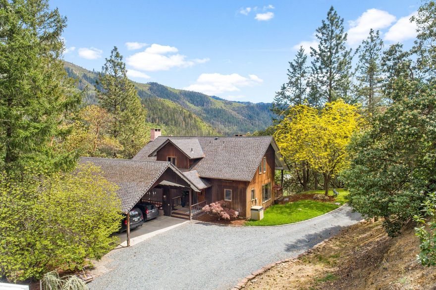 Welcome to this unique, Applegate Valley home & property w/ breathtaking views of surrounding valley, mountains & river! Escape to privacy, yet close enough to all amenities & award winning wineries! Imagine waking up to views of snow capped mountains & ending your day w/ beautiful sunsets & stargazing. Two level home w/ finished daylight basement that includes large rec room, seating area, bed & full bath. Main level features living, dining, office space, full bath, kitchen/pantry, utility room & separate eating area off kitchen. Upper level boasts expansive primary en suite w/ dual vanity, 2 walk in closets. Large, picturesque windows w/wood blinds provide an abundance of natural light throughout! Plenty of storage in the home! Room for RV, trailer or any toys you have! Fire/ember suppression installed w/ hoses & sprinklers on roof. Incredible water pressure w/ 4000 gallon storage tank. This property backs up to BLM and is looking for a new owner to make it their own! Tour today!