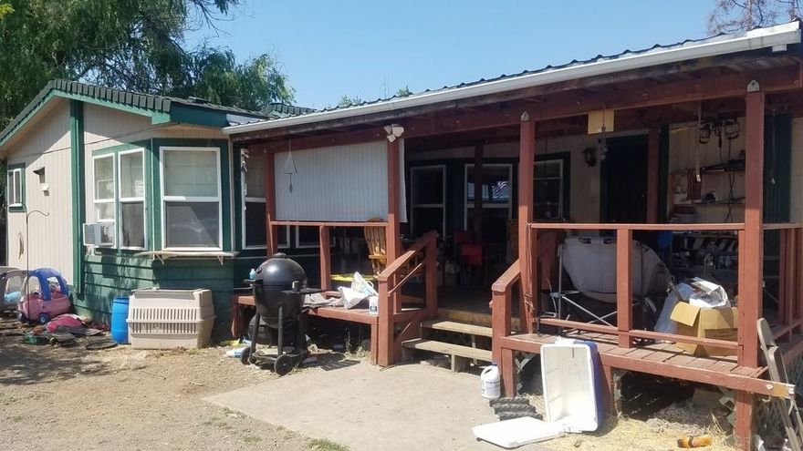 Spacious 1.21 acre parcel with pretty mountain scenery!  1993 Double-Wide.  Detached 2-car garage.