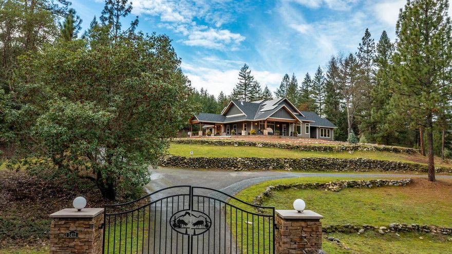 Welcome to a wonderfully private, luxurious and modern self-sustaining home. Just 3 miles from Jacksonville, and a short drive to Ashland or the Medford International Airport, this 16-acre estate radiates quality and privacy. State of the art automated systems include pharmaceutical grade water filtration to home and garden; strong well with large holding tanks; solar panels with backup batteries, a 40kW propane generator, plus geothermal heating and cooling. Noted kitchen designer Roger Shollmier (winner of an HGTV award) personally designed this kitchen including his patented 'Galley' sink system. Wolf and Bosch appliances, Hubbardton Forge lighting, and Oregon Walnut trim throughout the home. Outbuildings include a 3000+ sq ft shop, 20x30 ft greenhouse, rabbit/chicken house, and a 90x120 ft garden/orchard that produces 100% organic food, flowers and more. High speed cable internet, and close enough to town that local restaurants deliver here.