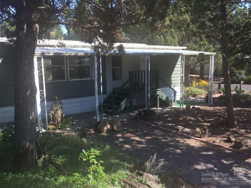 Lots of character in this well maintained top of the line (1973) Fleetwood MFG home on a large private & landscaped lot. It seems much larger than it 1400SF w/3 bdrms & 2 full baths. Plenty of open & flexible living space with built-ins, & loads of closet space too! Updates include a newer roof, 2006 furnace & heat pump/air conditioning, 2015 water heater (50 Gal), newer stove, & more. Enjoy the painted walls that bring life to the traditional paneling! A big back porch, carport, & 3 storage sheds!