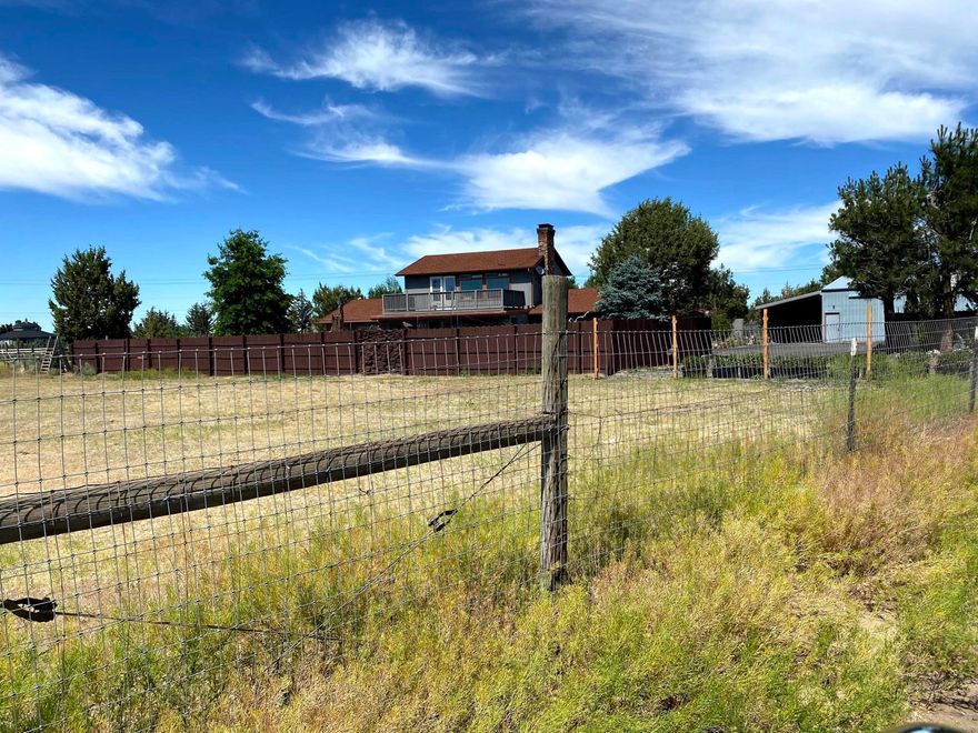 A rare find only 3 miles from downtown Sisters. Fully fenced property, several outbuildings and barn. A true horse place. Barn, outbuildings, gazebo, 2nd story deck looks to the Three Sisters. This house has great bones and will need updating to make a new owner's paradise.  Roof replaced with high grade arch composition 8-9 years.