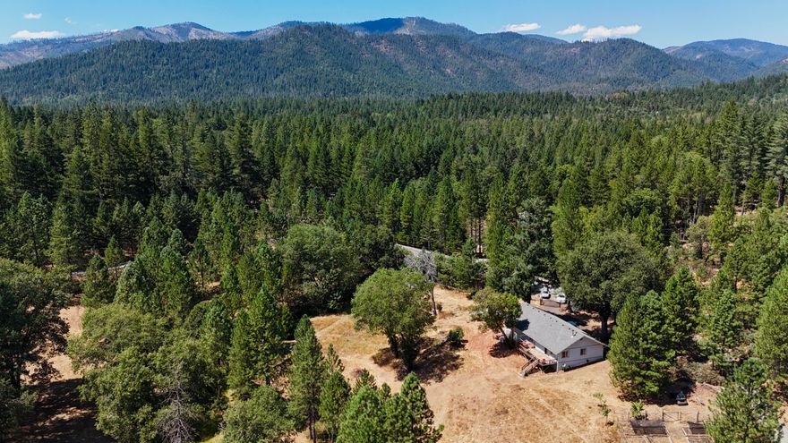 Your little slice of the Oregon dream! 10 acres backing Draper creek with apple, plum, pear, grapes -well established. Fenced for animals and cross fenced for gardening! 2 wells, with the agricultural well boasting 30GPM on the well log for keeping things green! private and rural setting only 20 minutes to Grants Pass. book a showing today!