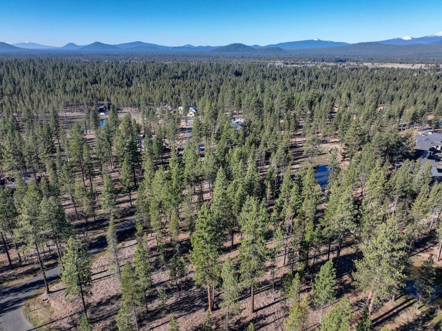 Born from the legacy of Sunriver, Caldera Springs is the Pacific Northwest's premier residential resort community for families seeking a sense of peace, privacy, and four seasons of outdoor adventure. Sited across 1,000+ acres of forests, lakes, streams and trails, each home and homesite has access to an array of exclusive amenities creating a one-of-a-kind wilderness getaway and just 15 miles from Bend. Homesite 327 offers a gradual slope downward toward the north with possible views of Mirror Rock Lake  and stream with a sunny western exposure. This larger coveted 25,700 sq ft lot size may allow a 6 bedroom home to be built. Buyer to review the attached ARC Guidelines.  Short term rentals are allowed in the community, no permit required. Call today for the plat map and begin designing your vacation, or second,  home getaway.