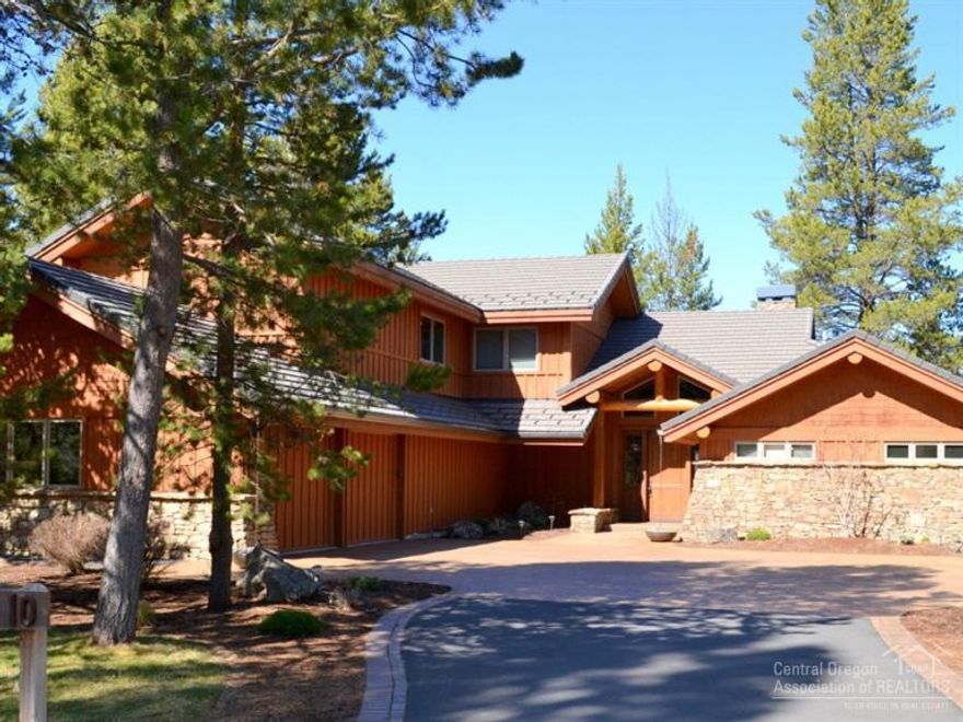 Views, views and more views! With a fantastic floor plan & an amazing setting, this home delivers the best that Sunriver has to offer. Gorgeous finishes including log accents, slab granite, commercial grade appliances & hand carved wood accents create a special rustic mountain feeling. Out back enjoy your lake front paver patio while soaking up the golf course view across the water. Master Suite on the main level, with two more suites upstairs, plus a bonus room over the garage & a huge hobby room.