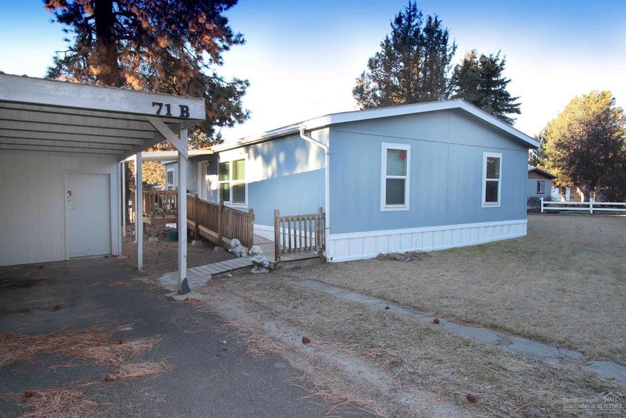 Great mobile home in a family park. Home backs to open area, giving a park like feel. Great room floor plan makes this a wonderful home. Spacious kitchen and master bedroom- walk in shower and handicap accessible. Includes all appliances including washer and dryer. Newer laminate flooring, fixtures & water heater. New buyer must be approved by park prior to submitting an offer. Space rent is $670.00 per month which includes water, sewer and garbage. Close to everything Central Oregon has to offer.