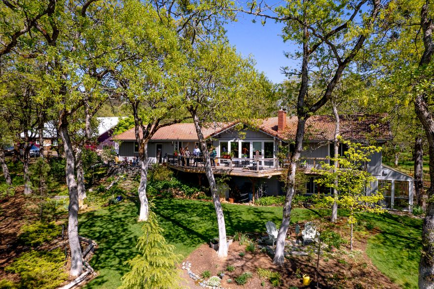 Nestled in Oregon's picturesque wine country, this immaculate home on 23 gorgeous, gated acres is a dream come true - a paradise offering natural beauty, as well as vineyard views. A 60x60 barn provides a shop with running water, tons of storage, enclosed RV parking and a shelter for your horses or livestock. The 3 Bed/4 Bath main home is surrounded by oak groves, pristine pollinator gardens, boasts 2 sun porches and views of the Cliff Creek Cellars' vineyards. The home features a tile roof, fully remodeled kitchen, a gorgeous living room with floor to ceiling HE windows, bamboo flooring and a Blaze King high efficiency wood stove. Knotty pine doors and trim bring nature inside. The lower level is a daylight basement has a bedroom+bath along with a spacious den with propane stove, a giant storage room and a solarium!  Don't let this opportunity pass you by!