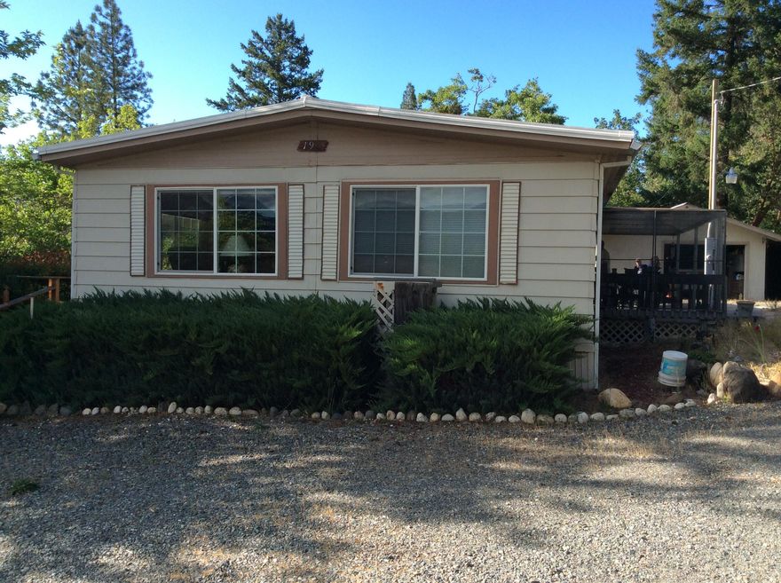 This precious home has been well cared for and loved.  Two bedrooms, two full baths, diningroom with hutch cupboard, wood stove , garage and RV port all on an acre of land.  Come look at this home and property, you will not be disappointed.