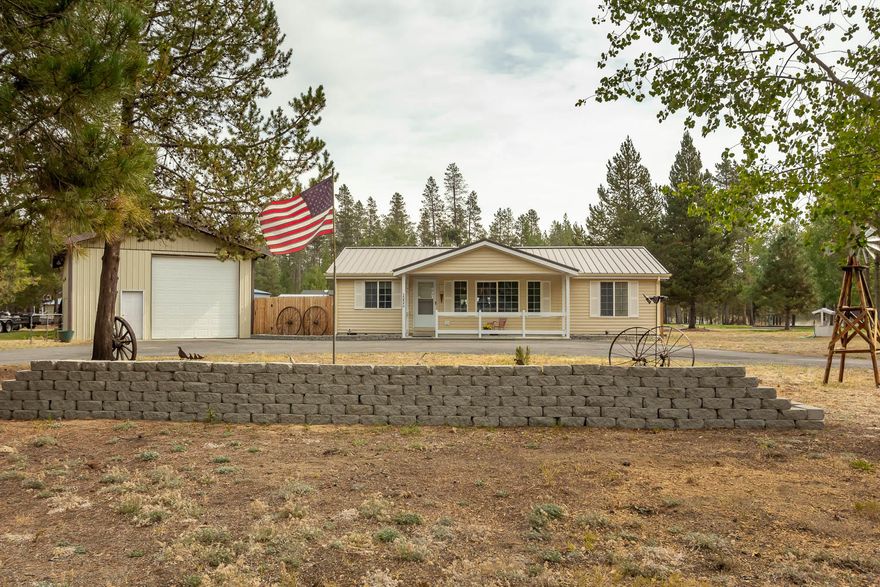 Come check out this immaculate 3-bedroom, 2 bath home located  on a corner 1.03 acre lot. Located on the north end of La Pine.  The property features a large RV cover with complete RV hookups for 30-amp or 50-amp RV.  828 SF fully insulated Garage/Shop with certified Lopi woodstove and plenty of storage & heated craft room. The home has vinyl siding with a metal roof for easy maintenance. Paved driveway, road maintenance included on yearly property taxes. Updated within the last 2 years, countertops throughout, flooring throughout, interior painting throughout, heat pump, front porch, exterior trim painted, new toilets, new faucets, all new sinks throughout, dishwasher, oven/range, refrigerator, new hookup for washer and dryer, new light fixtures, ceiling fan, just to name a few. Call to preview today!