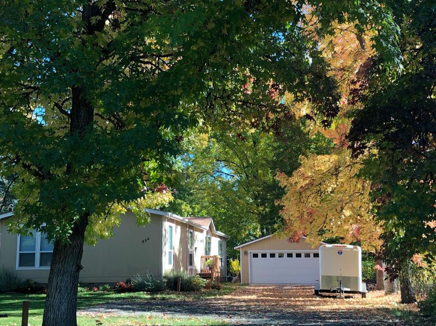 Beautiful parklike setting with mountain views. Level and fully fenced with electric security gate. Open floor plan with high end window coverings, Master suite with walk in closet, soaking tub and dual sinks. RV parking behind second gate, Detached double car garage, 28x20 woodshop with 110 & 220 power, vacuum tubes and wall heater. Assorted flowers and fruit trees, garden area and patio. Just minutes to Grants Pass or Rogue River. Anyone considering purchasing the property should perform their own investigation into the uses and condition of the property. Buyer to do their own due diligence.