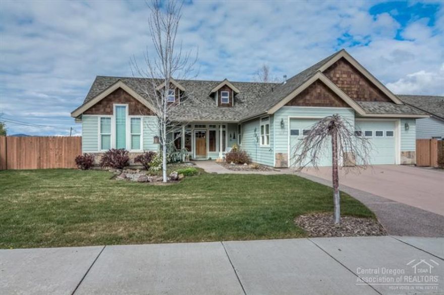 Spacious, both inside & out! Exceptionally well-maintained single level on very large lot (13,000+sq. ft.). Arched Entry welcomes you to open Great Room w/lots of natural light, rock F/P with concrete raised hearth, large concrete wrap around Brft Bar in Kitchen--great for entertaining (and some views of Cascades from here!) All Bedrooms feature very high ceilings w/fans for spacious feeling. Back fully fenced, landscaped, raised beds, large patio w/Pergola, awning, firepit, shed & addtl storage both sides.