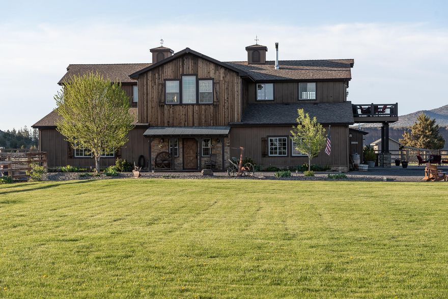 Stunning canyon-riverfront property on 10+ acres along the Crooked River. Custom-built home with 3,049 sqft of luxurious living space. 3,375 sqft of attached garages & stalls. 3 spacious bedrooms & 2 full bathrooms upstairs with elevator. Open layout with vaulted ceilings & large windows. Beautiful kitchen with stainless appliances, propane range & ample counter space. Great room features wood burning stove with stone accents & leads to deck overlooking property. Convenient laundry room with built-ins. Guest quarter/office with full bathroom downstairs. Great flexible space with separate entrance. Bonus room/''Western'' bar leads to outdoor patio. 4 attached oversized garages. Heated mechanical/tack room & 2 attached horse stalls. Beautifully landscaped yard with stunning views. 2 authentic poultry coops, greenhouse, fenced-in garden & custom-built gazebo. This property offers the ultimate in privacy & serenity, while still being just a short distance from all the amenities you need.