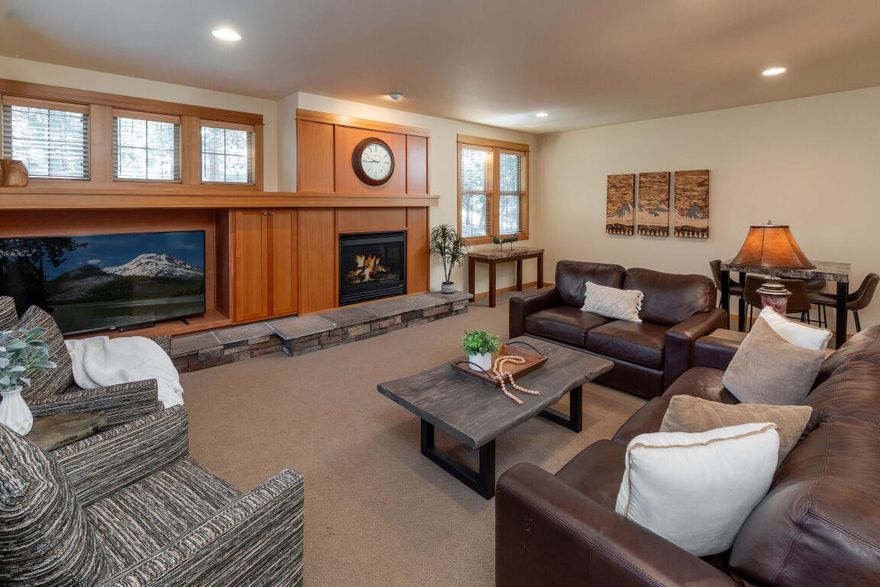 Experience refined mountain living in the heart of Sunriver. This beautifully crafted 3-bedroom, 3.5-bath townhome offers over 2,200 sq. ft. of open-concept space in Fremont Crossing—a gated enclave perfectly positioned between the Village and SHARC. Designed with timeless architectural detail, it features gable roofs, cultured stone accents, and wood-wrapped windows. Vaulted ceilings and open great room with gas fireplace create an inviting ambiance, while the chef's kitchen showcases stainless steel appliances, granite surfaces, and hardwood flooring. Two luxurious primary suites, a private hot tub, expansive deck, and oversized 2-car garage with generous storage elevate everyday comfort. Offered turnkey with tasteful furnishings, air conditioning, and washer/dryer. Whether as a serene retreat or savvy investment, 2 Fremont promises elegance, convenience, and enduring memories in Central Oregon's premier resort community. Create your legacy!