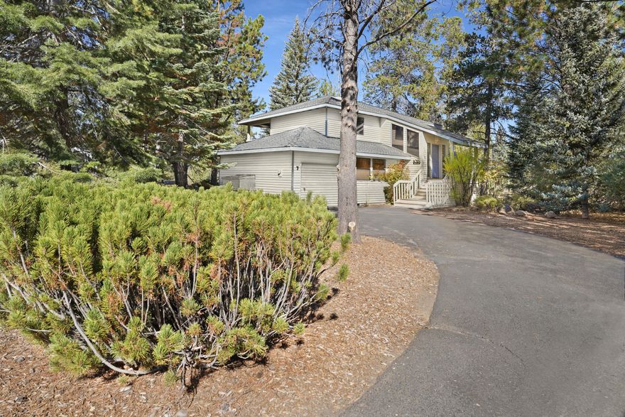 Rare Turnkey STR near Deschutes River with $60k annual income! Welcome to 7 Rogue - Where Relaxation Meets Adventure! Beautifully remodeled Sunriver retreat tucked on a quiet loop just steps from the Deschutes River & trail system. Open great room with new bamboo flooring, custom wrought-iron railings, and an Ochoco Stone-wrapped wood-burning fireplace. The new gourmet kitchen features Café matte-black stainless appliances, custom cabinetry & pantry, butcher-block island, wine cooler, tiled backsplash & granite counters. Three bedrooms, 2.5 baths + garage game room (shuffleboard, darts, bikes). Rare private backyard with hot tub under the pines - a true Sunriver find! New roof (2023), dual water heaters, central A/C, Smart TVs in every room, 8 SHARC passes & keyless entry. All furnishings negotiable for a fully turnkey experience. Minutes to Cardinal Landing Bridge, Fort Rock Park & The Village. Listing agent related to seller.