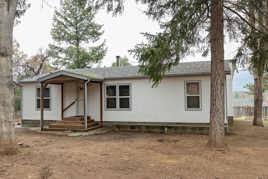 Great 3 bedroom 2 bathroom home on .65 acre lot. This home has a split floor plan with laminate flooring throughout the living room and kitchen. The kitchen has hickory cabinets and includes the refrigerator and range and dishwasher. The bedrooms are carpeted and the main bedroom has a walk in closet with an extra-large bathroom.  Out back there is an enormous, covered deck to enjoy the outdoors with sunsets of the valley. The back yard has lots of raised beds for gardening. There is a 720 Sq Ft garage with lots of room for extra toys or shop area. This property is fully fenced.