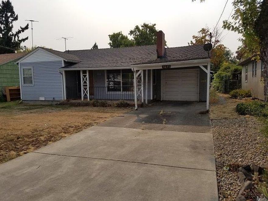 Cottage home with large yard and shop for extra storage. Lots of room in fenced back yard for kids or pets. Quiet neighborhood with plenty of street parking. Sit by the fireplace on those cold Winter nights.