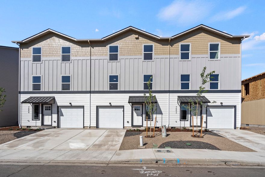 Step into contemporary elegance with this stunning new townhome by Olaf & Company, LLC. This move-in-ready residence offers 1,363 sq. ft. of modern living space. It features three bedrooms, including a convenient ground-floor bedroom, and two luxurious upper-floor bedrooms with their own ensuites, providing both comfort and privacy. The middle floor boasts a spacious kitchen with granite countertops and upgraded cabinets, ideal for culinary enthusiasts. The open-concept living and dining areas are designed for both relaxation and entertaining. The upper floor includes washer and dryer hookups for added convenience. Enjoy breathtaking views from the top floors and benefit from additional features such as an oversized single-car garage, a fully fenced backyard, Milgard windows, and 100% Hardie Siding. Practical entry area storage enhances functionality. An Energy Performance Score will be provided upon completion. One of only three left, come get it before it's gone!