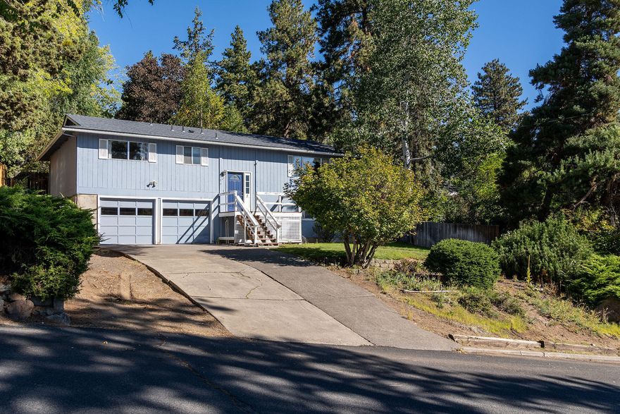 Nestled within the picturesque west hills of Bend, this exceptional mountain-view property offers a generously sized, fully fenced yard alongside a spacious back deck that is ideal for both entertaining guests and enjoying moments of relaxation. The oversized garage features a workbench and ample storage space, making it perfect for a variety of projects. A cozy pellet stove enhances the inviting atmosphere of the living area, contributing to the overall comfort of the home. This property beautifully combines practicality with natural beauty, making it an exceptional place to reside. Its advantageous location is just minutes from Pioneer Park and the river, downtown Bend, and only a 30-minute drive to Mt. Bachelor, providing easy access to outdoor adventures and urban amenities alike, thus making it a perfect retreat for both nature enthusiasts and city dwellers.