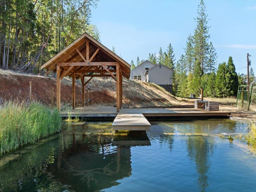 Spacious and thoughtfully updated, this 4-bedroom, 2-bath home offers 2,924 sq ft of versatile living space, including a daylight basement with its own entrance and full bath—ideal for multigenerational living, guest quarters, or a potential rental setup. The open floor plan flows beautifully, with recent upgrades including new siding, Armstrong commercial-grade laminate flooring, Pella windows and slider, energy-efficient mini-split systems, an updated bathroom, and fresh interior/exterior paint. Upstairs features two bedrooms, a bonus flex space perfect for an office or playroom, and generous storage throughout. Step outside to your private outdoor oasis: a stunning 65' x 45' crystal-clear organic pool with a cedar deck and pergola, plus a play structure and room to roam. The large upper deck is perfect for relaxing or entertaining while enjoying the peaceful natural surroundings. This unique property blends comfort, functionality, and outdoor beauty.