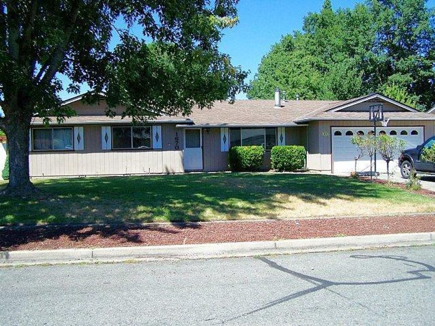 This well maintained home was built in 1980. Home offers 1488 square feet with three bedrooms, two baths and a family room. Back yard is fenced with ample room for the 2 or 4 legged kiddo's. Heating/cooling system was upgraded to a gas/electric heat pump. Front room is inviting with a wood stove and large windows for natural light. Family room is conveniently located off of the kitchen with glass sliders leading to the patio. Hot tub awaits thru the sliding glass doors off of the master. Conveniently located to Grants Pass