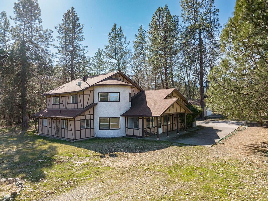 Quiet & Private Creek-Front Property in the Williams Valley! This Property Offers a 3 Bed, 2 Bath, 2,894 Sq Ft Contemporary Tudor-Style Home, Two-Car Garage, Detached 30'x24' Shop, Numerous Smaller Outbuildings, & Absolutely Stunning Williams Creek Frontage. The Well-Kept & Updated Home features a Spacious Country Kitchen with Granite Counters & Dining Area, Formal Dining Room, Living Room w/Woodstove & Office! Huge Master Suite w/Classy Bathroom that features Dual Vanities, Tile Floor, & Walk-in Closet. Two Nice Guest Bedrooms, & a Quality Guest Bath with Tile Floors & Large Shower. Impressive Sweeping Staircase to the Upper Level. Fantastic One-of-a-Kind Medieval Chandelier graces the Living Room. Several Storage Sheds & Multi-Use Buildings. Level Useable Land, Established Mature Orchard, Fenced Garden, & plenty of room for Animals. Spectacular Williams Creek Frontage, with Easy Access & Trails, plus Privacy with no Visible Homes across the Creek. Quiet Dead-End Country Road Setting.