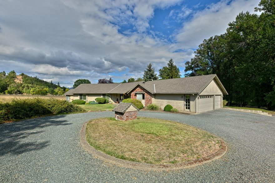 This well-built home offers room to breathe both inside and out. Set on a beautiful, level 5.05-acres, the property features open space, garden potential, and a large back deck overlooking the grounds and tree-lined backdrop. Built with care by the original owner and now offered by the second owner, this 2,196 sq ft 3 bed, 2 bath home includes many updated systems. Inside, you'll find a generous floor plan with large living spaces, tiled kitchen with island seating and wood floors, plus a dining area featuring a built-in white oak buffet. While the home is well maintained, it offers an excellent opportunity for cosmetic updates to make it your own. Whether you're looking for room to garden, keep animals, or simply enjoy peaceful surroundings, this property offers an excellent opportunity to own a serene retreat with all the right features.
