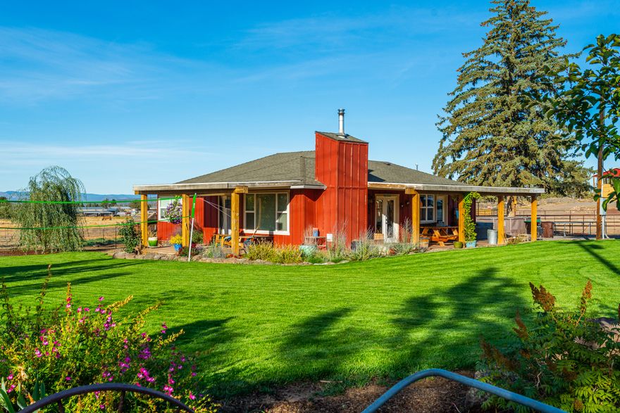 Prime hay ground and cattle ranch in Powell Butte, conveniently located in Central Oregon, less than 30 minutes to the municipal airport, hospitals, shopping and an abundance of recreation.  This 92.81 acre property with 65.25 acres of irrigation offers a 40 x 60 ft shop with a 14 foot roll up door with loft and a walk in freezer, a 40 x 60, 20' high hay barn, and a 24 x 36' with 14' eves that wrap around with 6 covered runs.  There is 8x20 seperate tack room.  The cattle working area has 3 pens, a Priefert chute and Ritchie automatic waters.  There is an 220' x 140' outdoor arena with a cattle return alley that is set up for roping and has the ability to practice pole bending, barrel racing and goat tying or a place that you can brush up on your riding skills.  All irrigation equipment which includes  a pivot, wheel line and drag lines and a 25 HP pump is included.  Remodeled 3 bedroom 2 bath home with covered porches allows you to enjoy the Powell Butte evenings you won't want to mis