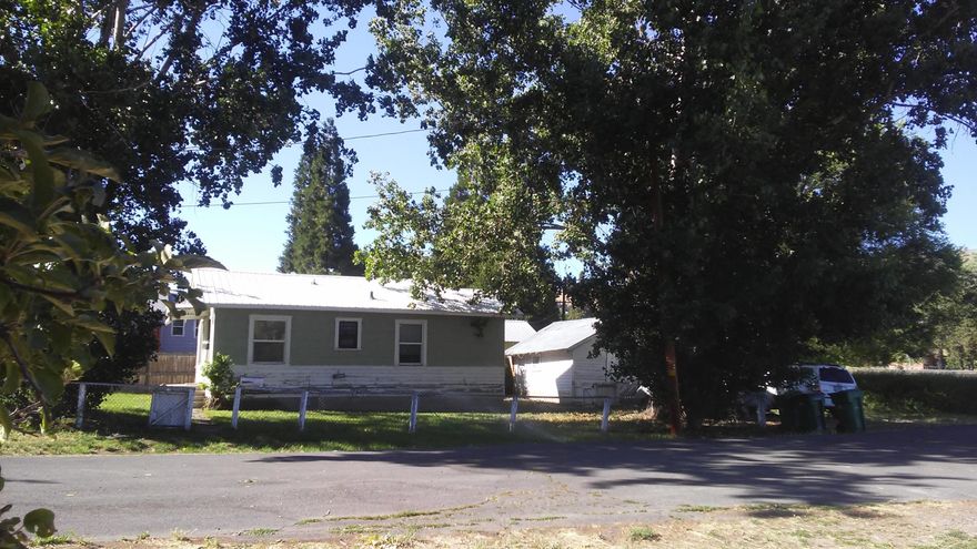 Are you interested in a cute cottage home waiting to give it your own personal touch?  Here It Is!  A one bed one bath cottage with a detached 1 car garage.  Yard is fenced on a short dead end street with plenty of mature trees.  Close to schools, shopping and medical centers.  Home will need some TLC,