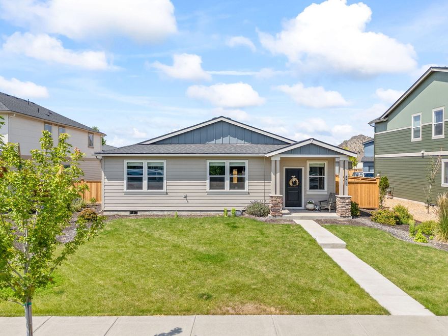 Step into this award winning floor plan by D.R.Horton builders. Incredibly hard to find 4 bedroom, 2 bath w/large open concept living. Updated engineered hardwood throughout, modern farmhouse finishes, and light neutral colors in each room make this home feel like an oasis. This floor plan has split living with bedrooms spaced apart to utilize one as a private office, and still have 2 additional guest/kid rooms. The primary is its own retreat with oversized windows, tall ceilings, & large ensuite w/double vanity, quartz counters, huge walk in closet, shower, & enclosed toilet. Walking distance to the elementary school & Barnes Butte trail/hiking system. Low maintenance yard w/in-ground sprinklers, dog run area, xeriscaped backyard. Extra long alley access driveway w/room to park extra toys like RV's and boats. Incredible value for the size! Don't miss this one.