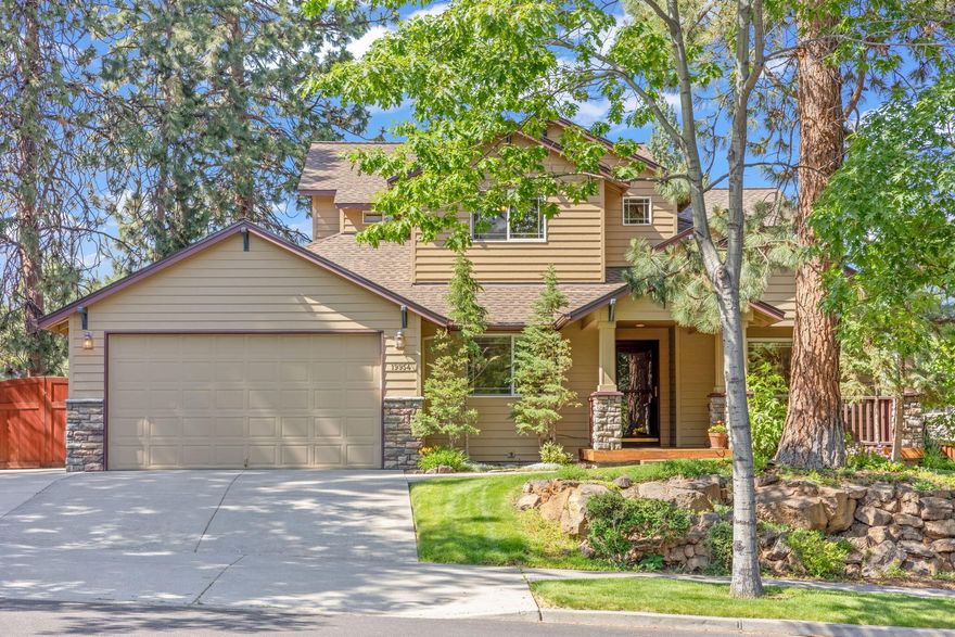 Tucked beneath the pines in a quiet SW Bend neighborhood, 19954 Cliffrose Dr blends timeless charm with thoughtful design. This 4-bedroom, 3-bathroom home offers 2,239 sq ft of well-appointed living space on a beautifully landscaped .22-acre lot comes with a top of the line Mitsubishi heat pump system with whole house filtration and ionizer system. The show-stopping oversized backyard feels like a private garden retreat—lush and serene with ponds, water features, sitting areas, and vibrant landscaping. A spacious elevated deck offers panoramic views of this peaceful oasis, perfect for relaxing or entertaining. Warm wood tones, covered porches, and stone accents lend classic Northwest appeal, while the tree-lined setting completes this uniquely tranquil home.