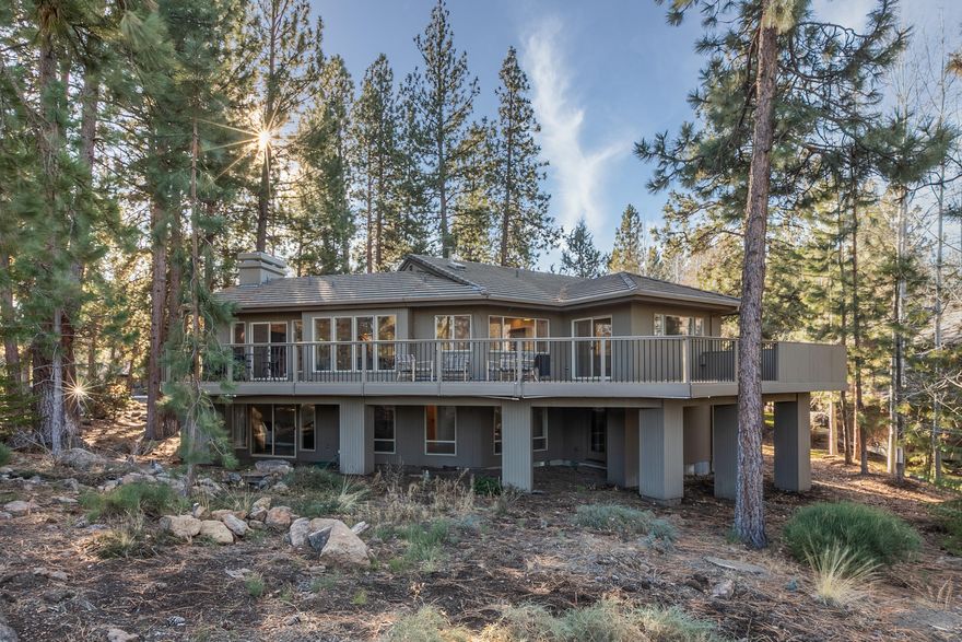 Stunning Mountain Modern home nestled among the pines on half acre, overlooking the 1st fairway in the golf community of Broken Top! This 2844 sq. ft., 3 bedroom, 3 bath, split level has had a complete interior renovation including a beautiful Western Dry Stack stone fireplace, leathered chiseled edge granite kitchen counters, new cabinets, Miele appliances, refinished whitewashed oak floors, shiplap walls & ceilings, Restoration Hardware lighting, new stair railing & many other designer touches! Main living upstairs w/ guest room & a large master suite featuring beams & wood detail on ceiling, radiant floors, Brizon Litze accessories, access to back deck. Lower level features 3rd bedroom, a family room w/a mini kitchen & a flex room, perfect as an office or craft room. Professional wine cellar off the oversized 2 car garage. Huge back deck w/fabulous view of the golf course. Enjoy miles of trails within Broken Top, the restaurant & w/ membership golf, tennis & pool!