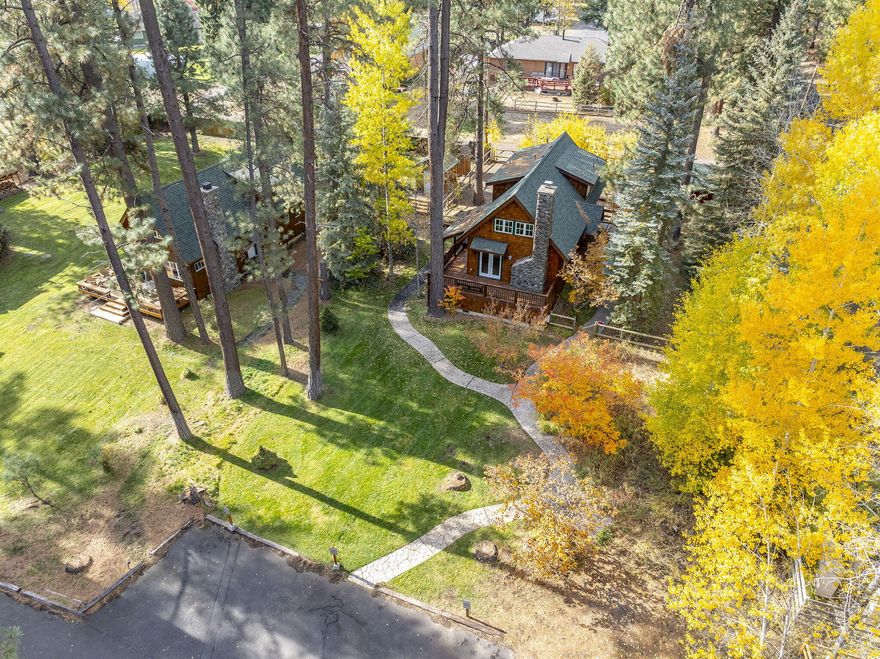 Check out the fresh stain and paint, plus incredible fall colors! An unrivaled location and deeded property and land which means no limits on your ownership, enjoyment and use. Not USFS, No HOA and Not part of a resort. Mere minutes from world-class flyfishing on the Metolius River, plus the Camp Sherman Store and Hola Restaurant. Charming 3 bedroom, 2 bath cabin offers a vaulted great room with log accents and wood burning stone fireplace, open kitchen, laundry, and wrap around porch. The main floor bedroom has french doors to a private patio. Upstairs enjoy a spacious primary suite plus loft bedroom. Winterized for year 'round enjoyment. Ample storage throughout plus a shed for all of your toys. Furnished and ready to go.