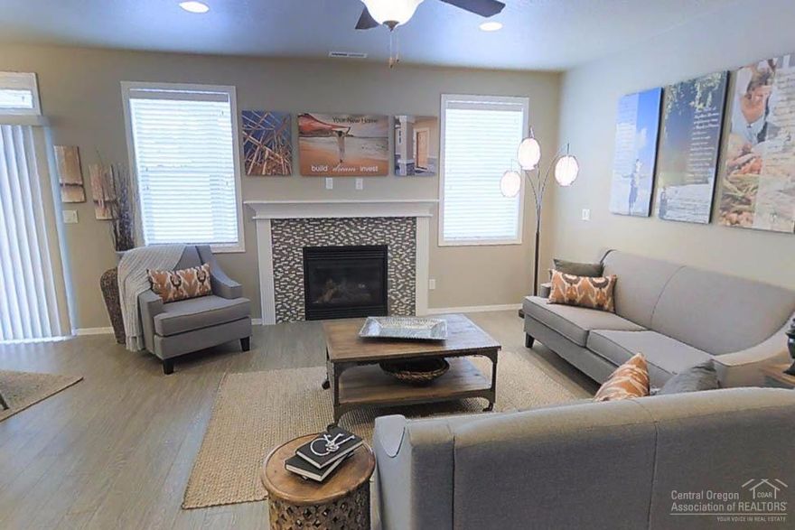 The 1574 square foot Hudson single level home offers a rare 3rd car garage. The open concept kitchen has counter space galore, plenty of cupboard storage and a breakfast bar. The expansive living room and adjoining dining area complete this eating and entertainment space with a cozy fireplace. Enjoy your covered patio as an extended living space. The private master suite boasts a dual vanity bathroom shower with glass enclosure and an enormous closet with great separation from the other 2 bedrooms.