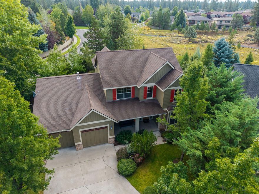 Set on a large, private lot backing to a meadow, this west-side, 4-bedroom+office home is a quiet retreat with Bend's outdoor lifestyle at your doorstep. River Rim's extensive trail system links to Wildflower Park, Sunset Hill, the Deschutes River and River Trail, and Brookswood Plaza's restaurants, retail and pet amenities. Known for superior craftsmanship and quality finishes, this Hendrickson-built home has 8' wooden doors and an exposed beam in the vaulted living room. Expansive windows fill the living and dining area with natural light. The primary suite, office, and laundry room offer true main-level living. Upstairs, 3 bedrooms and full bath are connected by a generous landing--a bonus flex space. Outside, the nearly ¼ acre provides multiple areas for gardening, play, or enjoying the surrounding natural beauty. This home has been well maintained and thoughtfully updated, including a new roof, water heater, exterior paint, most kitchen appliances in the last few years