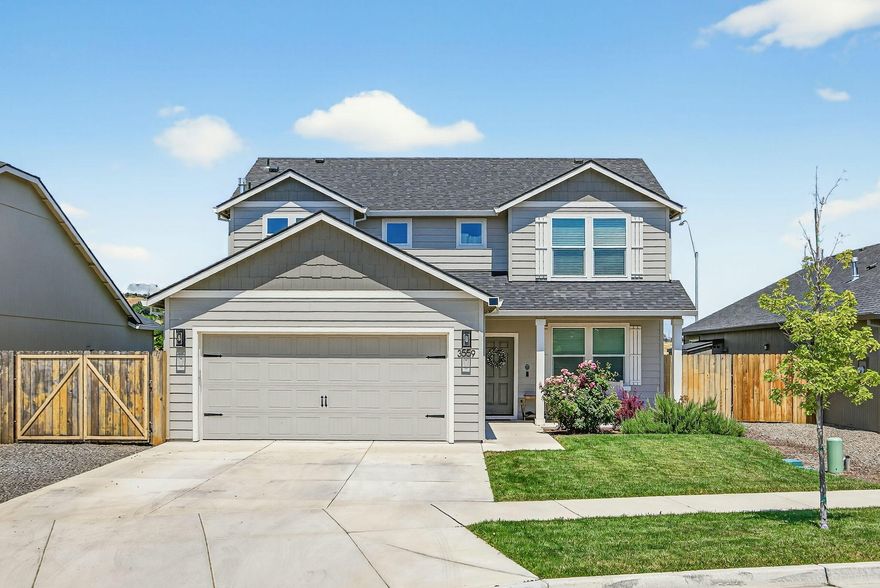 WOW! The search is over, you're home! The entry sets the mood for the rest of this open concept home. There is 1 bdrm downstairs perfect for an office or space for the kiddos. The kitchen, dining & living spaces flow together seamlessly. The kitchen has beautiful cabinetry, quartz counters, stainless appliances, island & pantry. The dining area will accomodate a large family & has a slider to the back yard. The living space is large enough for a sectional yet cozy with a gas fireplace. A built-in desk & 1/2 bath complete the downstairs. The 2nd story has the utility room, the primary suite with walk-in closet, ceiling fan, great views of the nearby hills, double vanity, soaking tub & stall shower. The other 2 bdrms also have views of the hills & the 2nd bath has a single vanity & tub/shower. The spacious back yard has raised garden beds, small shed & great views of the nearby hills.