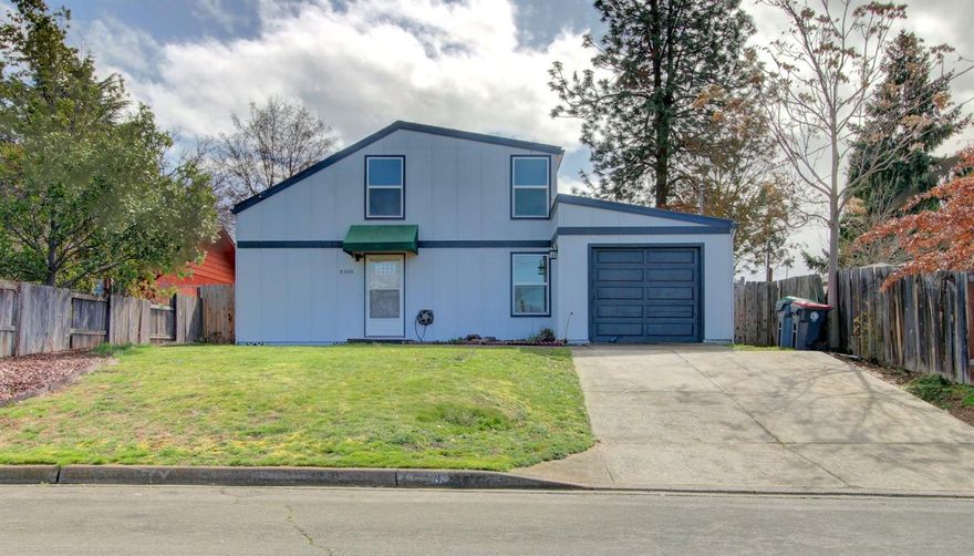 Incredibly Unique and Located in Old East Medford, this Home Has Too Many Updates to List! Surrounded by mostly owner-occupied homes in the Wilson Elementary School District, with a huge back yard with big covered patio that includes an above-ground pool, ready for Summer fun! Enter into shining laminate (& tile) floors throughout the main level living area, towering vaulted ceiling with an open staircase and hall to the second floor, and tons of natural light beaming in. A great galley-style kitchen boasts plenty of cabinet space. The master suite is on the main level and has a beautifully updated bath with tile accents and walk-in shower. There are 2 more good-sized bedrooms upstairs separated by a 2nd full bath. All new vinyl windows throughout top off this charmer, as well as a 1-car finished garage and big 10x12 shed in back for plenty of storage. This is a must tour home!