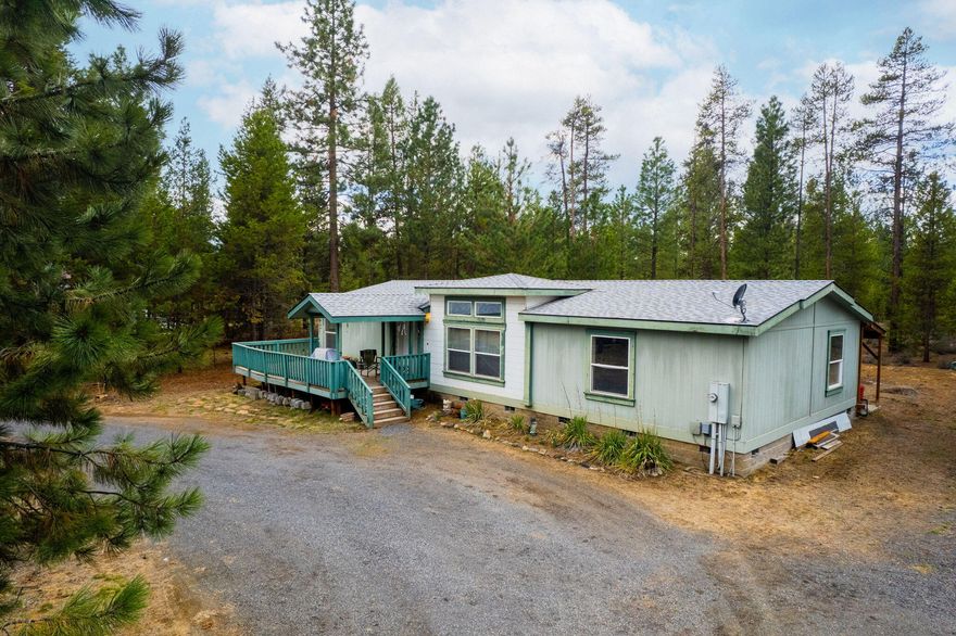 Just off Burgess Road in the Forest View neighborhood, you'll enjoy the peace and quiet of this home in the woods. Situated on just over an acre next to the Deschutes National Forest, the home has all the amenities you're looking for including 3 bedrooms, 2 baths, vaulted ceilings, and an open floor plan. Outside the house you'll find an inviting deck to enjoy sunny days, or go to the back of the house to soak in the private hot tub under the covered patio. Sellers have put money into the property with a new well, septic and pump system in 2022, and a new roof on the house in 2020.. House and deck could use some TLC. With a detached 2 car garage and an additional storage shed, this house has everything you need!