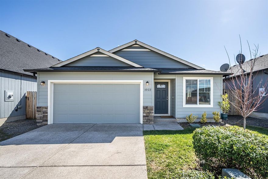 Newer single-level craftsman home centrally located in Cherry Meadows Subdivision of Southwest Medford. High-end details include vaulted ceilings, granite countertops and upgraded blinds on all windows, and stainless steel appliances including electric range, microwave, dishwasher, and French door refrigerator. Beautiful kitchen with an eating bar, wooden and glass-fronted display cabinetry, adjacent dining area with sliding glass door to covered concrete patio and fully fenced back yard. Vaulted master with walk-in closet, en-suite bath with step-in shower. Two additional bedrooms and full bathroom with tub/shower combo. Two car garage. Property fully landscaped and equipped with sprinkler system. Move-in ready!