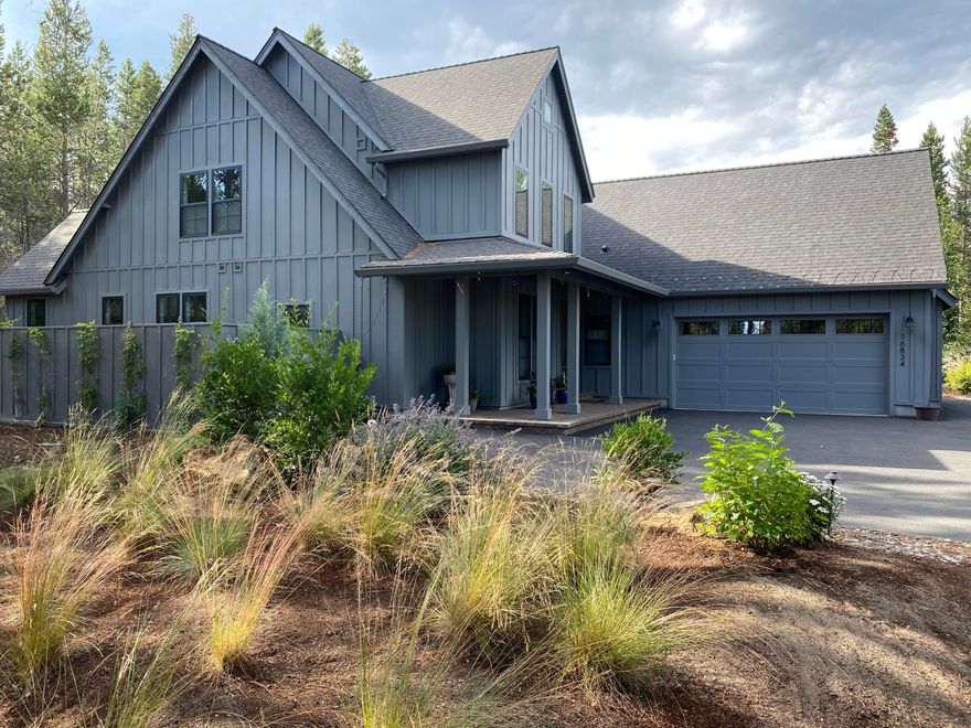 Builder's own custom 2022 Modern Farmhouse Cottage in revered River Meadows.  Across street from Deschutes River & boat ramp. Primary bdrm on main, plus 3 bdrms w/walk-in closets upstairs (1 can be large bonus). 2-story great room and entry with floor-to-ceiling natural stone frplc & windows.  Engineered hardwood flooring on main. Chef's kitchen with high end appliances: including sous vide & induction, hot water dispenser and full height custom cabinets w/undercab lighting. Quartz counters, m/w drawer & hot water dispenser. Walk-in pantry. Trex decking. Large paver patio & propane firepit. Primary has private access to enclosed hot tub area from bathroom. Professional landscaped w/irrigation. Oversized 2 car garage. SS steel dog wash! Man door from garage accesses covered enclosed area w/heat pump & garbage cans. River Meadows amenities include pool, pickle ball courts, paved trails and docks. Seller licensed broker. Paved streets.