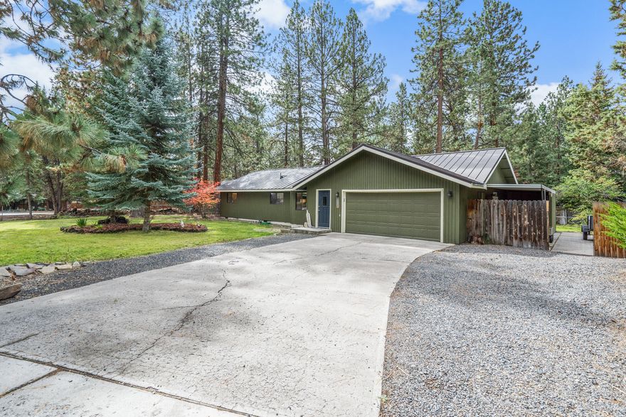 Wonderful single level home located close in SW Bend on a quiet street with no through traffic. 1616 SF 3 bedrooms with two full baths and two living room spaces. Two car garage PLUS additional separate 550 SF insulated shop with a garage door. Plenty of room for all your toys, RV, boat, etc. with two driveways and fenced in trailer parking . Wood floors throughout, metal roof, new interior doors and paint. Open concept kitchen, dining, family room area. Park like setting on nearly a half acre with mature trees, garden beds and plenty of room to roam. Potential for ADU, Buyer to do due diligence on development opportunities. Convenient to the Old Mill, parkway, great schools, under a mile to the river trail. All the best of Bend. Check out the video! Open house 2-5 pm on Saturday the 9th.