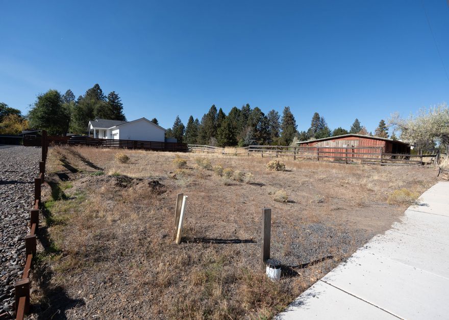 Fantastic opportunity to build in one of Bend's most desirable and convenient neighborhoods. This generously sized .14 acre lot sits in the sought after Orchard District of Midtown, just steps from Hollinshead park, known for it's much loved community garden, Waterwise demonstration garden, off-leash dog area, and historic barn.  Located on a peaceful accessible dead end street with no HOAs or CC&Rs, giving you flexibility to design and build your dream home.  The lot provides excellent Solar Access for Passive Solar Design and is RS zoned, allowing the potential to build multiple units.   Ideally close to schools, St. Charles, downtown Bend, and with quick parkway access.  This lot offers a rare blend of convenience and neighborhood charm. Building plans included with sale.  Buyer responsible for due diligence regarding zoning and potential units.