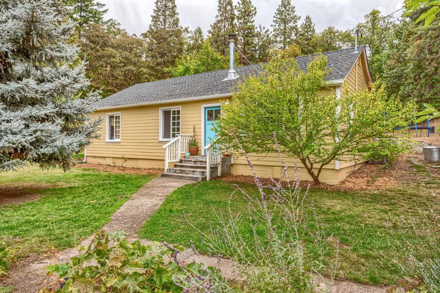 Fabulous, light-filled cottage on stunning 5.95 acre deer fenced parcel w/rolling irrigated pastures & beautiful wooded areas. Wonderful, tree-lined driveway takes you to the completely remodeled/almost rebuilt home. Engineered wood plank-style floors throughout the open floor plan. Great kitchen w/large center island, marble counters, farm sink (w/reverse osmosis system for drinking water) & pantry. Sweet master bdrm with private deck. Central heat & a/c plus woodstove. UV system on well. Laundry room is off the kitchen. Pull down ladder access to wonderful storage area. There is a sheep shed (sheep can be included), old shop building & chicken house. The land boasts a wide variety of mature fruit trees, raspberries, strawberries & blueberries and raised garden beds. Lots of potential for growing grapes and more. Fantastic location and near hiking trails. This property will more than delight you!