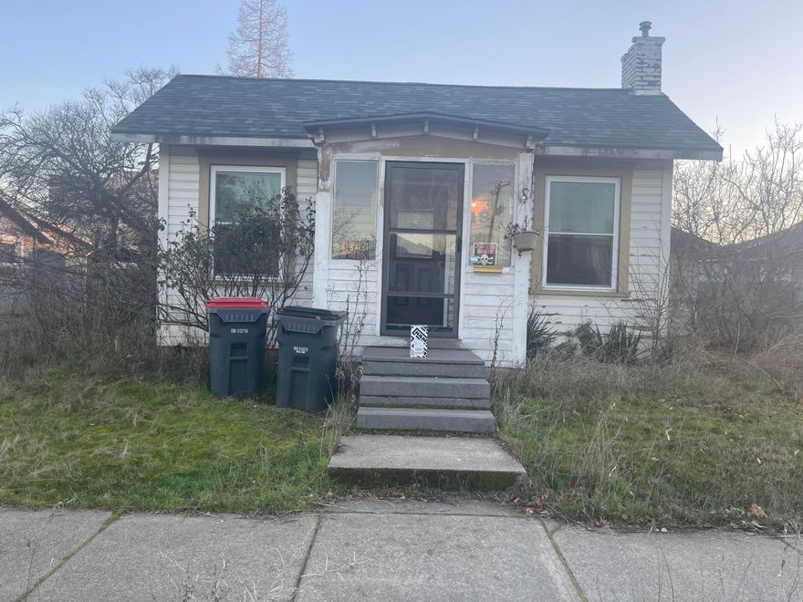 This progressive era home consists of a large living room, galley kitchen, dining area, laundry room, one true primary bedroom and an office/spare room. With the right care and restoration, it can be a great starter home or rental. Large lot with alley access. New roof in 2019 Possibility of ADU or additional unit, per City of Medford the lot could hold an additional two units if the space works for it buyer to do own due diligence.