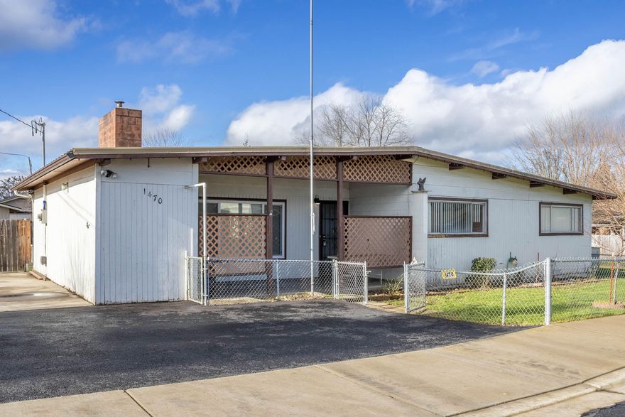 This is the perfect property for a first time home buyer or investor! This single level home is full of charm and character including hardwood floors, a metal roof, a huge backyard, and more! There are 3 bedrooms, 1.5 baths, and 1077 square feet on 0.19 acres! This is also a small attached workshop and a huge paved parking area. A second power service has already been stubbed, and you could build an ADU or potentially partition, and build a full second residence. Call for your tour today! This one won't last long!