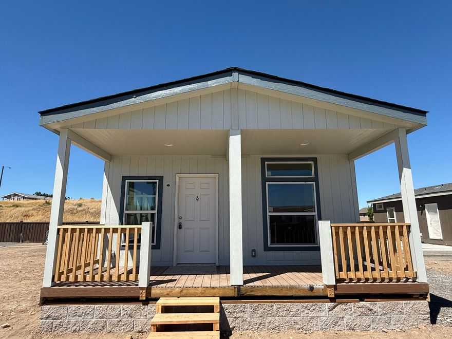 Welcome to Summer Place, Madras's newest gated manufactured home community  just minutes from downtown and local dining.
This brand-new 3-bedroom, 2-bath home offers 1,023 square feet of well-designed living space. The exterior features pearl gray paint with slate tile trim and an estate gray roof for modern curb appeal. Inside, alabaster paint creates a bright, neutral backdrop. The kitchen boasts knotty cabinets, Bello Romano counters, and a full arctic ceramic tile backsplash, while the bathrooms feature aluma marble counters with matching backsplash. Flooring includes westwood vinyl in main areas, with oxford carpet in bedrooms and living room. Stainless steel appliances, a built-in microwave and dishwasher, andA 6-foot front porch, 1-car attached garage, and paved double-wide driveway complete the package. Space rent ranges from $595 to $650/month, with purchase options available for custom order. Call EXIT Realty Today!