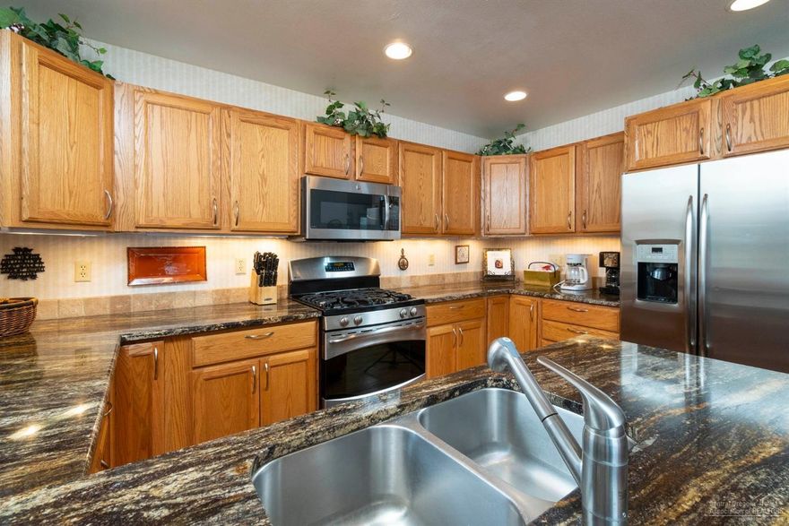 Cute Sunriver cabin in a quiet location! 2 bedrooms/2 baths downstairs, plus an additional large loft upstairs that is set up as a 3rd sleeping area with a closet and full bath. Kitchen includes granite counters, gas cook top and stainless appliances. Cozy family room with a rock/gas fireplace, large windows and vaulted wood ceilings. Wonderful outdoor space with landscaped yard, hot tub and large deck overlooking common area. Updated bathrooms with granite counters, attached double car garage and much more. Strong rental history. Sold furnished and ready for you to enjoy!