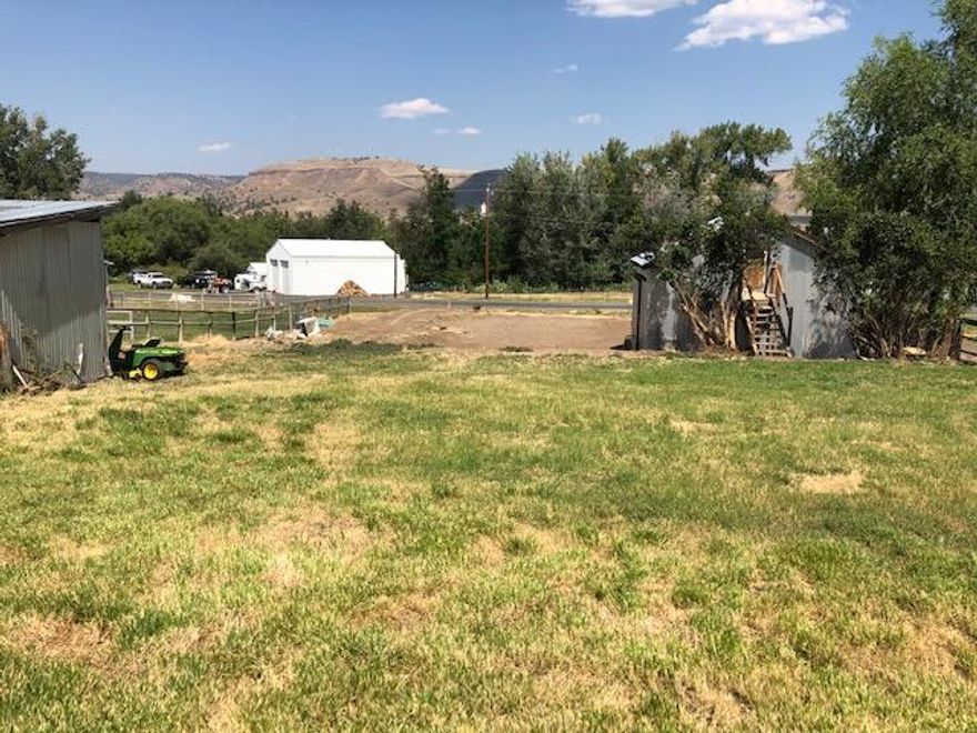 Small Irrigated Country Setting In Dayville!
Located on .59 of an acre, buildable, city services, fenced, small livestock barn, large shop w/loft, nice mt views, irrigated by Cummings Ditch.
$55,500
 #1027
