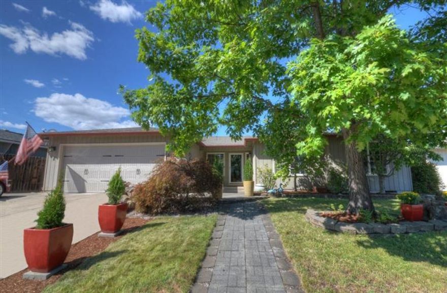 Looking for a dream kitchen? Check out this stunning 3 Bedroom/ 2 Bath home in a great area of Southwest Medford. Enjoy this open and spacious 1545 sqft home and a large 270 sqft screened in back porch not included in the sqft. The large beautiful kitchen offers brand new cabinets, granite counters, custom movable island and all stainless appliances including the gas range, dishwasher, refrigerator and beverage cooler. Kitchen can be left open with the vaulted living area or closed off with the French doors! Another set of French doors lead to the screened porch and back yard. The large master bedroom has a walk in closet and updated bathroom. One of the 2 spare bedrooms offers a huge closet for storage or mini office. The back yard is a gardeners delight with raised beds, gardening sheds, pathways, and more. Great curb appeal with the nice front yard, large paved driveway, new garage door, and mature landscaping. $1500 Paint Credit! Priced to sell quickly!